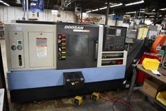 Doosan Lynx 300M CNC Turning Center with Live Milling, 12 Station Turret, 10" 3-Jaw Chuck, Tailstock, Tool Presetter, Parts Catcher, Chip Conveyor