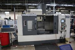 YCM Model NSV156A CNC Vertical Machining Center, Dual Chip Augers, Chip Conveyor