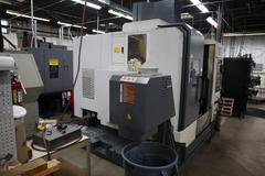 YCM Model NSV102A CNC Vertical Machining Center, 12K Spindle, 30 Station Side Mount ATC, Chip Conveyor