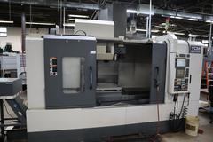 YCM Model NSV156A CNC Vertical Machining Center, Dual Chip Augers, Chip Conveyor