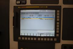 YCM Model NSV156A CNC Vertical Machining Center, Dual Chip Augers, Chip Conveyor