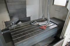 YCM Model NSV102A CNC Vertical Machining Center, 12K Spindle, 30 Station Side Mount ATC, Chip Conveyor