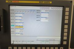 YCM Model NSV156A CNC Vertical Machining Center, Dual Chip Augers, Chip Conveyor