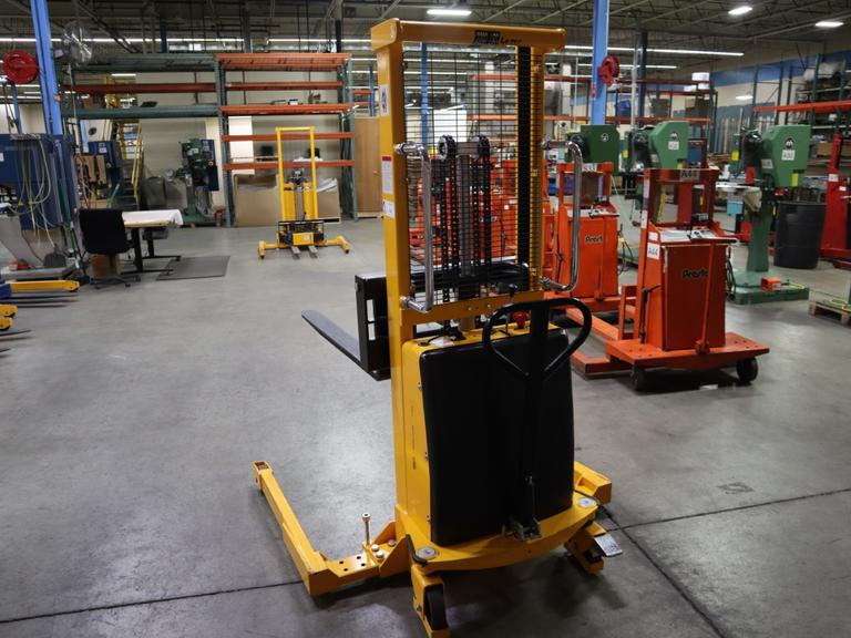 Uline H-5439 Electric Straddle Stacker Lift, 2,200# Cap, 63" Max Height, 50" Between Outriggers, 12 Volt Battery with Charger, 42" Forks