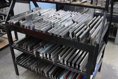 Press Brake Dies and Lower Die Holders for Amada Press Brakes on Welded Steel Shelving