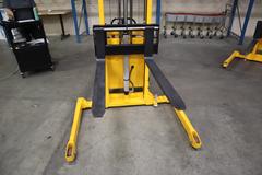 Uline H-5439 Electric Straddle Stacker Lift, 2,200# Cap, 63" Max Height, 50" Between Outriggers, 12 Volt Battery with Charger, 42" Forks