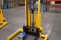 Uline H-5439 Electric Straddle Stacker Lift, 2,200# Cap, 63" Max Height, 50" Between Outriggers, 12 Volt Battery with Charger, 42" Forks