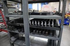 Press Brake Dies and Lower Die Holders Tall and Short for Amada Press Brakes on Welded Steel Shelving