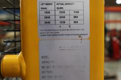 Uline H-2651 Electric Straddle Stacker Lift, 2,200# Cap, 63" Max Height, 50" Between Outriggers, 12 Volt Battery with Charger, 42" Forks