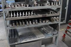 Press Brake Dies and Lower Die Holders Tall and Short for Amada Press Brakes on Welded Steel Shelving