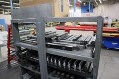 Press Brake Dies and Lower Die Holders Tall and Short for Amada Press Brakes on Welded Steel Shelving
