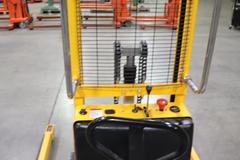 Uline H-5439 Electric Straddle Stacker Lift, 2,200# Cap, 63" Max Height, 50" Between Outriggers, 12 Volt Battery with Charger, 42" Forks