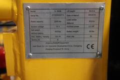 Uline H-5439 Electric Straddle Stacker Lift, 2,200# Cap, 63" Max Height, 50" Between Outriggers, 12 Volt Battery with Charger, 42" Forks