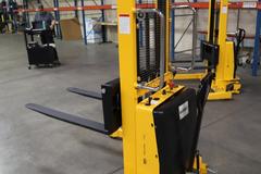 Uline H-5439 Electric Straddle Stacker Lift, 2,200# Cap, 63" Max Height, 50" Between Outriggers, 12 Volt Battery with Charger, 42" Forks