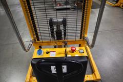 Uline H-2651 Electric Straddle Stacker Lift, 2,200# Cap, 63" Max Height, 50" Between Outriggers, 12 Volt Battery with Charger, 42" Forks