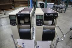 (2) Zebra 110Xi4 Label Printers, 203 dpi, 4" Wide Label Cap - On Wire Cart with Labels