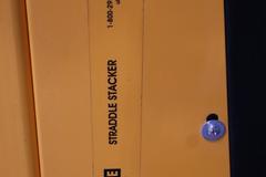 Uline H-5439 Electric Straddle Stacker Lift, 2,200# Cap, 63" Max Height, 50" Between Outriggers, 12 Volt Battery with Charger, 42" Forks