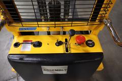 Uline H-5439 Electric Straddle Stacker Lift, 2,200# Cap, 63" Max Height, 50" Between Outriggers, 12 Volt Battery with Charger, 42" Forks