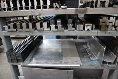 Press Brake Dies and Lower Die Holders Tall and Short for Amada Press Brakes on Welded Steel Shelving