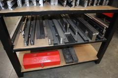Press Brake Dies and Lower Die Holders for Amada Press Brakes on Welded Steel Shelving