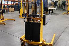 Uline H-5439 Electric Straddle Stacker Lift, 2,200# Cap, 63" Max Height, 50" Between Outriggers, 12 Volt Battery with Charger, 42" Forks