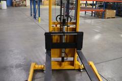 Uline H-5439 Electric Straddle Stacker Lift, 2,200# Cap, 63" Max Height, 50" Between Outriggers, 12 Volt Battery with Charger, 42" Forks