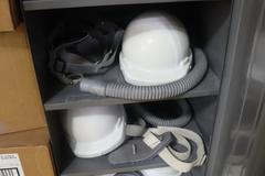 Tennsco 2 Door Metal Cabinet with Hard Hats, Clean Room Suits, and Other PPE Items