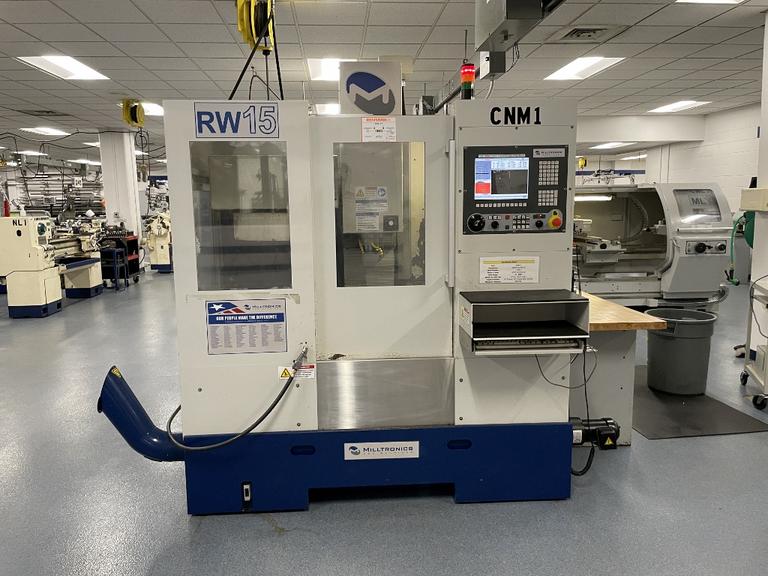 Milltronics RW-15 CNC Vertical Machining Center,  25" x 15" x 20.5". Series D, Milltronics 8200 Control, 16 ATC, 8K RPM, Probing, Chip Auger
