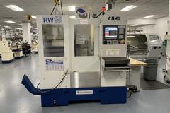 Milltronics RW-15 CNC Vertical Machining Center,  25" x 15" x 20.5". Series D, Milltronics 8200 Control, 16 ATC, 8K RPM, Probing, Chip Auger