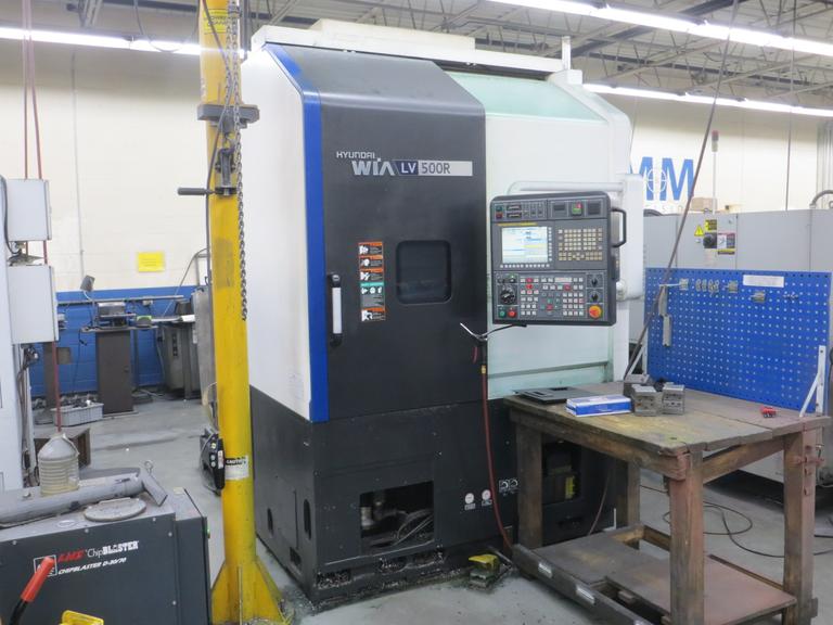 Hyundai Wia LV500R CNC Vertical Turret Lathe, Fanuc 32i, 15" 3-Jaw Chuck, 12-Station Turret, LNS/Turbo Chip Conveyor