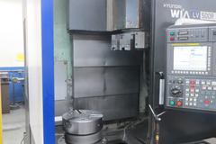 Hyundai Wia LV500R CNC Vertical Turret Lathe, Fanuc 32i, 15" 3-Jaw Chuck, 12-Station Turret, LNS/Turbo Chip Conveyor