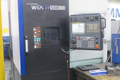 Hyundai Wia LV500R CNC Vertical Turret Lathe, Fanuc 32i, 15" 3-Jaw Chuck, 12-Station Turret, LNS/Turbo Chip Conveyor