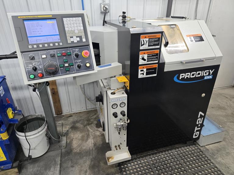 SNK Prodigy GT-27 CNC Gang Tool Lathe, Fanuc Series Oi Control,  C-Axis Programmable Spindle with Penumatic Driven Live Tools, Barfeeder, and Additional Tooling!