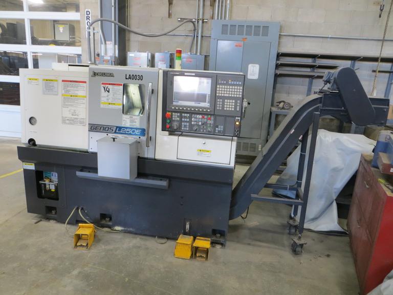 Okuma Genos L250E CNC Turning Center, OSP-P300L/R CNC Control, 8" Chuck, Tool Setter, Parts Catcher, 12-Station Turret, Tailstock, Chip Conveyor
