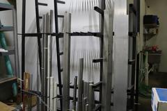 Vertical Metal Material Rack with Contents 