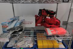 Safety and First Aid Supplies, Large Assortment on Uline 36" x 24" x 78" Metal Wire Rolling Cart