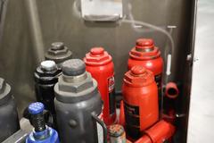 Assorted Hydraulic Bottle Jacks 2-12 Ton Capacity (9) w/ Rolling Cart