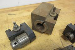 Aloris, Dorian, and Other CXA Quick Change Tool Post Holders, with 3 Boxes (12ea) 3/8 Carbide Tipped Stick Tools, Box of HSS Cutoff Blades