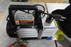 Rotary Vane Vacuum Pump with R134A Manifold Gage Set, Refrigerant Charging Hose Set and R-134A Refrigerant and Case.