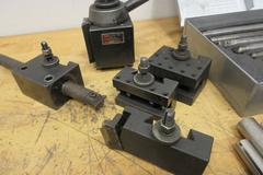 Aloris CXA Tool Post and (4) Assorted Holders, with Everede Tool Co. Boring Bar Set with Sleeves and Cutting Inserts