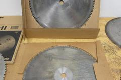 Cut-Off Saw Blades (4) Carbide Tipped Nap Gladu, Leuco and Other 16" x 1" **Used But Still Sharp**, (1) Hitachi 15" x 1" Wood Miter Saw Blade **Looks Unused**