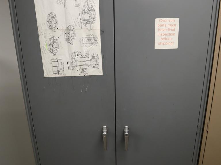 Steel 2 Door Cabinet with 7 Adjustable Shelves and Contents