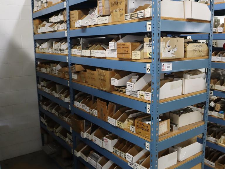 Teardrop Style Racking (2) 4' Sections, (18) Shelves,  with Contents of Mostly Aluminum Fixture Plates with Steel Hardware