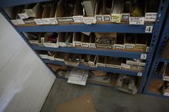 Teardrop Style Racking (2) 4' Sections, (18) Shelves,  with Contents of Mostly Aluminum Fixture Plates with Steel Hardware