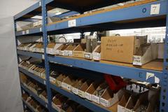 Teardrop Style Racking (2) 4' Sections, (16) Shelves,  with Contents of Mostly Aluminum Fixture Plates with Steel Hardware