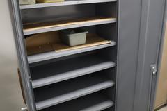 Steel 2 Door Cabinet with 7 Adjustable Shelves and Contents