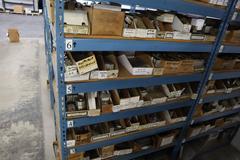 Teardrop Style Racking (2) 4' Sections, (18) Shelves,  with Contents of Mostly Aluminum Fixture Plates with Steel Hardware