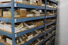 Teardrop Style Racking (2) 4' Sections, (18) Shelves,  with Contents of Mostly Aluminum Fixture Plates with Steel Hardware