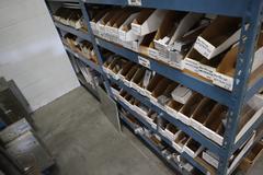 Teardrop Style Racking (2) 4' Sections, (15) Shelves,  with Contents of Mostly Aluminum Fixture Plates with Steel Hardware, And Tooling