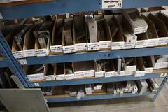 Teardrop Style Racking (2) 4' Sections, (15) Shelves,  with Contents of Mostly Aluminum Fixture Plates with Steel Hardware, And Tooling